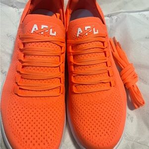 APL Orange Athletic Shoes with Breathable Knit and Sleek Design